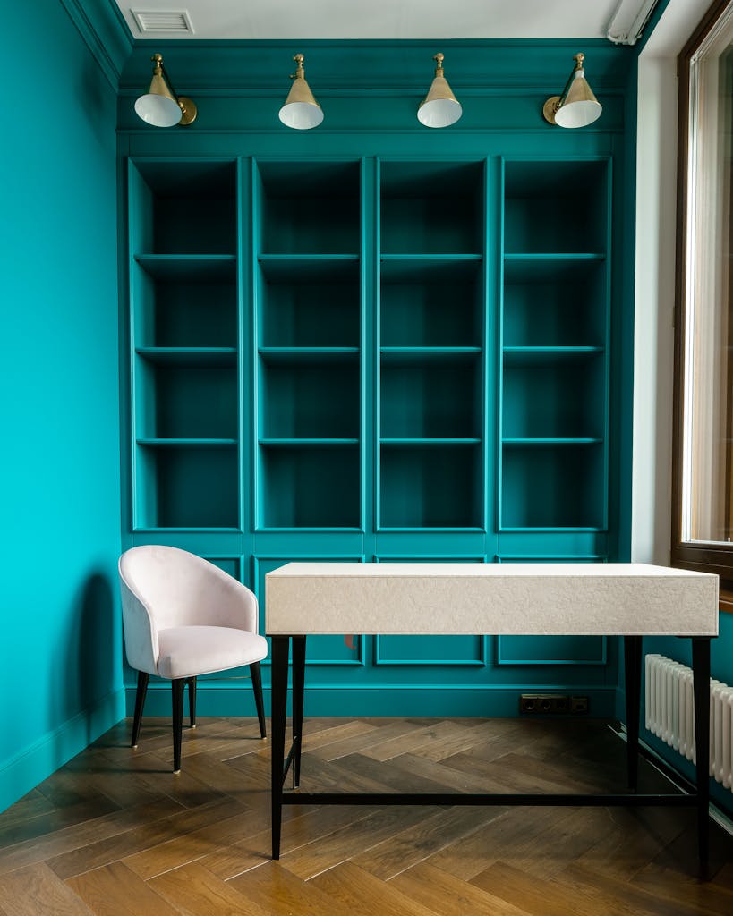 Tall floor-to-ceiling shelves in a small apartment holding baskets, books, and decor to maximize vertical storage