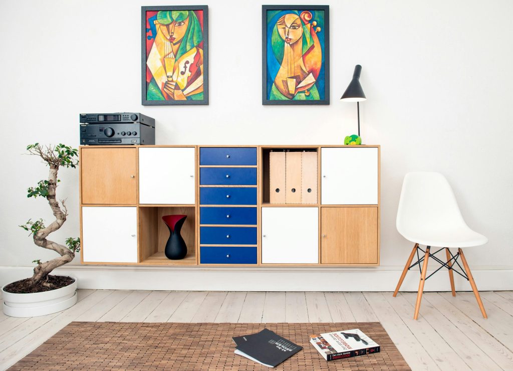 Stackable storage bins and modular units neatly organizing items in a small apartment space.