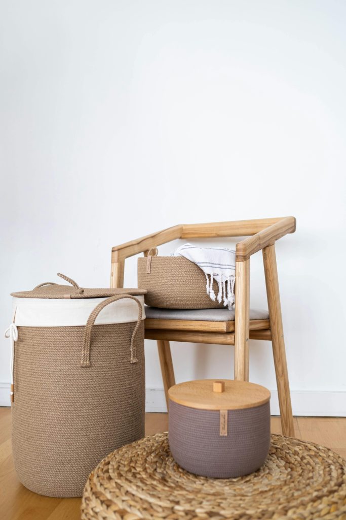 pexels-photo-8286098-8286098 Woven baskets neatly storing blankets and books in a small apartment living room.